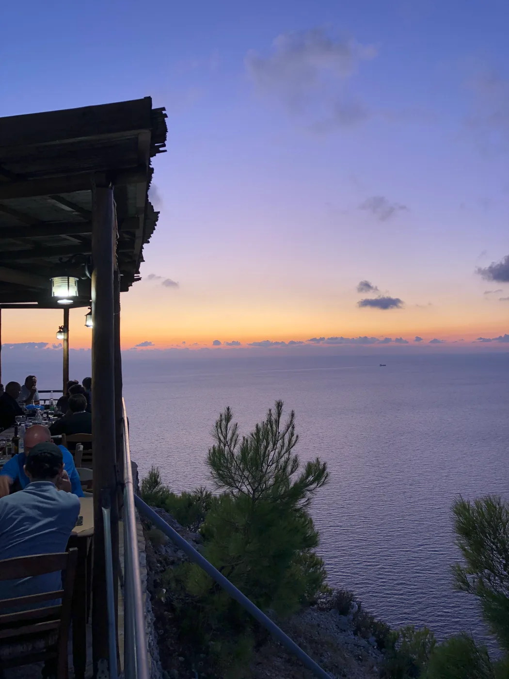 Sunset over the sea from a taverna in Kambi, high on the cliffs