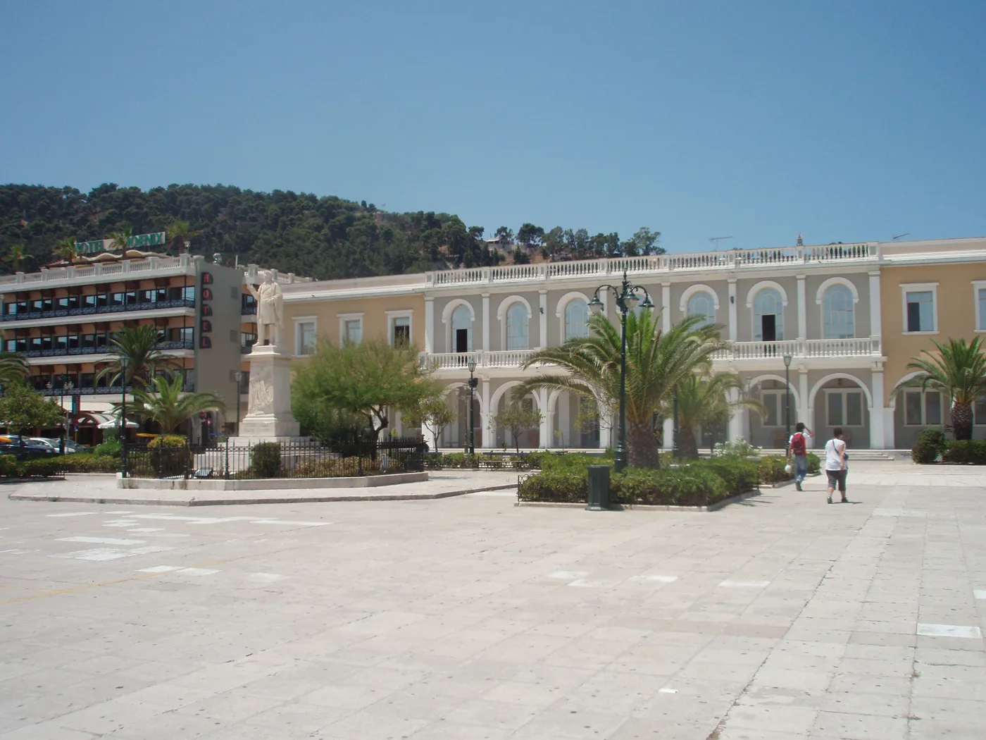 The large Solomos Square with neoclassical buildings and palm trees