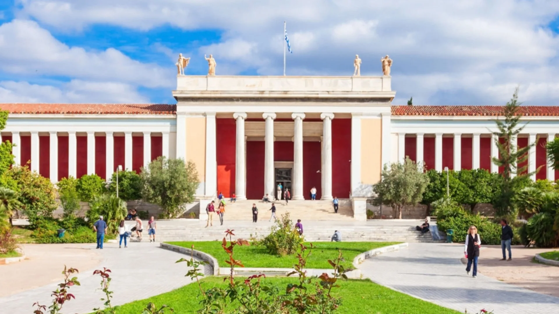 The neoclassical façade of the National Archaeological Museum of Athens at golden hour