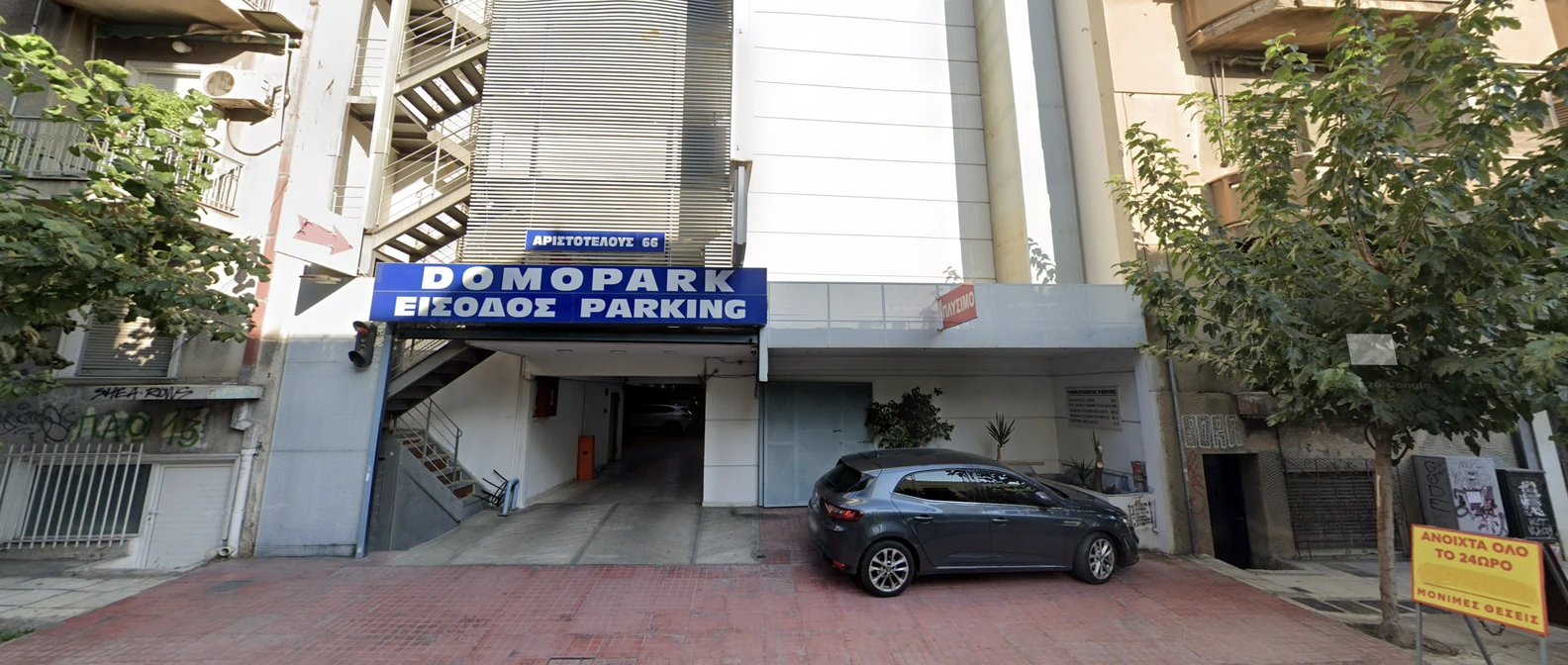 Modern underground parking garage interior in central Athens with neatly parked cars